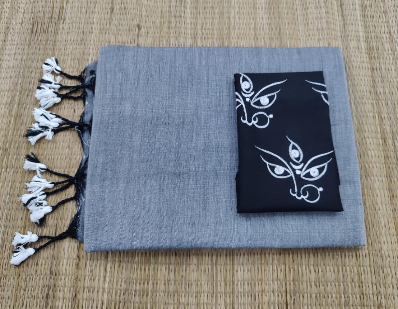 Plain cotton saree with embroidered blouse piece